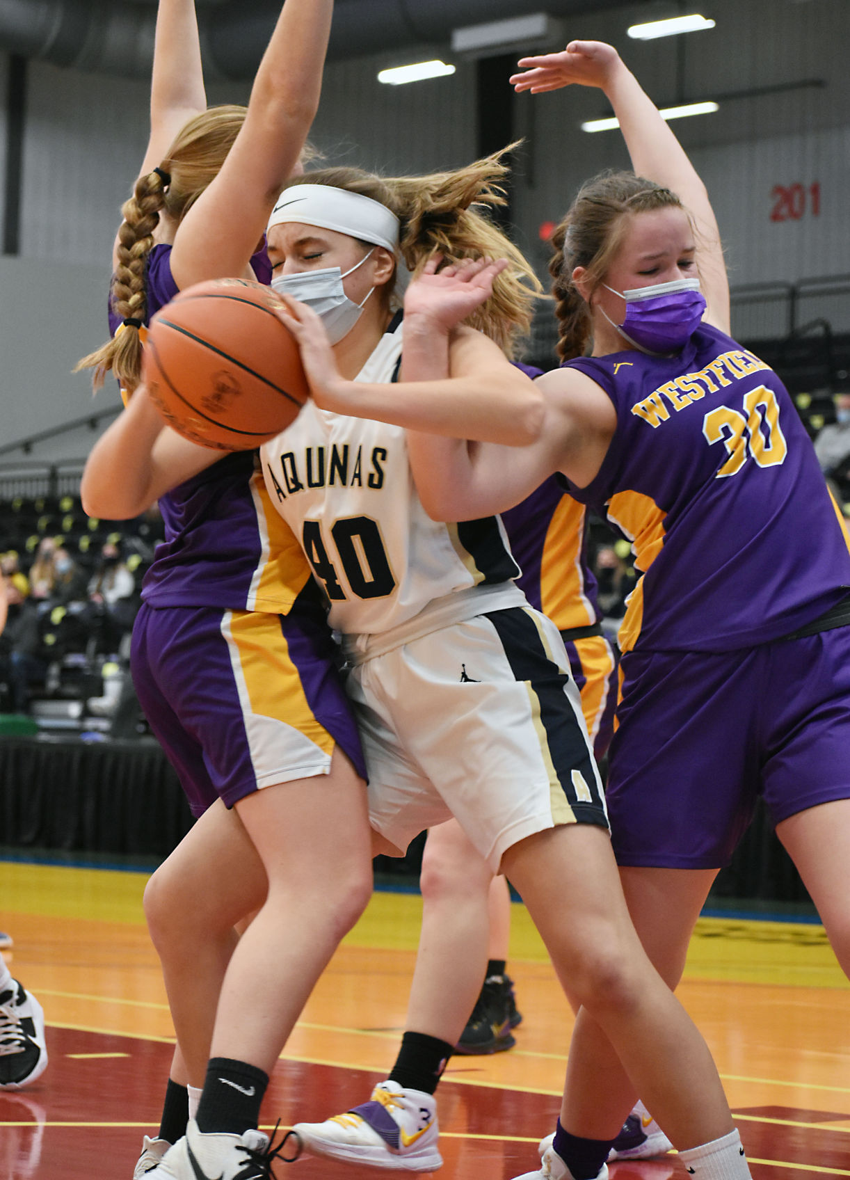 Gracie Cronk gets tangled up with a pair of Westfield defenders